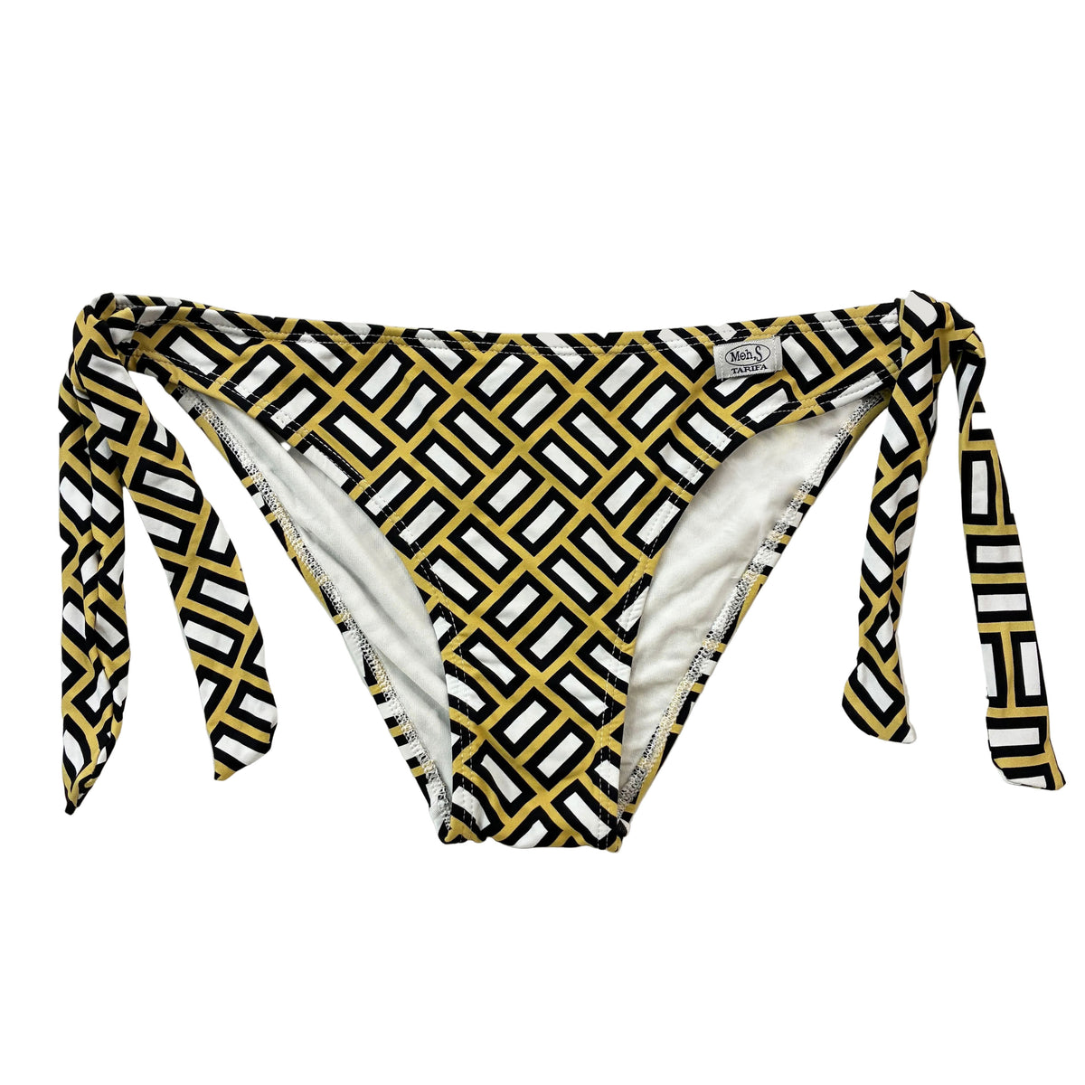 Braga de bikini ajustable con lazo lateral y estampado geométrico étnico en tonos mostaza, negro y blanco sobre fondo claro.