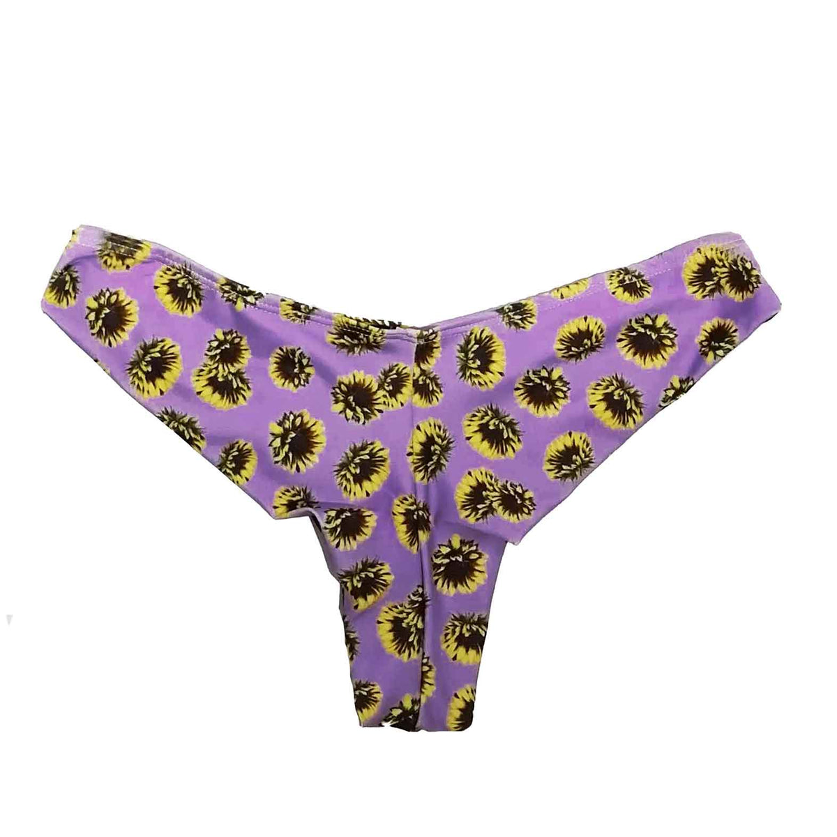 Trasera de braguita de bikini tipo tanga con estampado de girasoles sobre fondo lila, hecha a mano en Tarifa.
