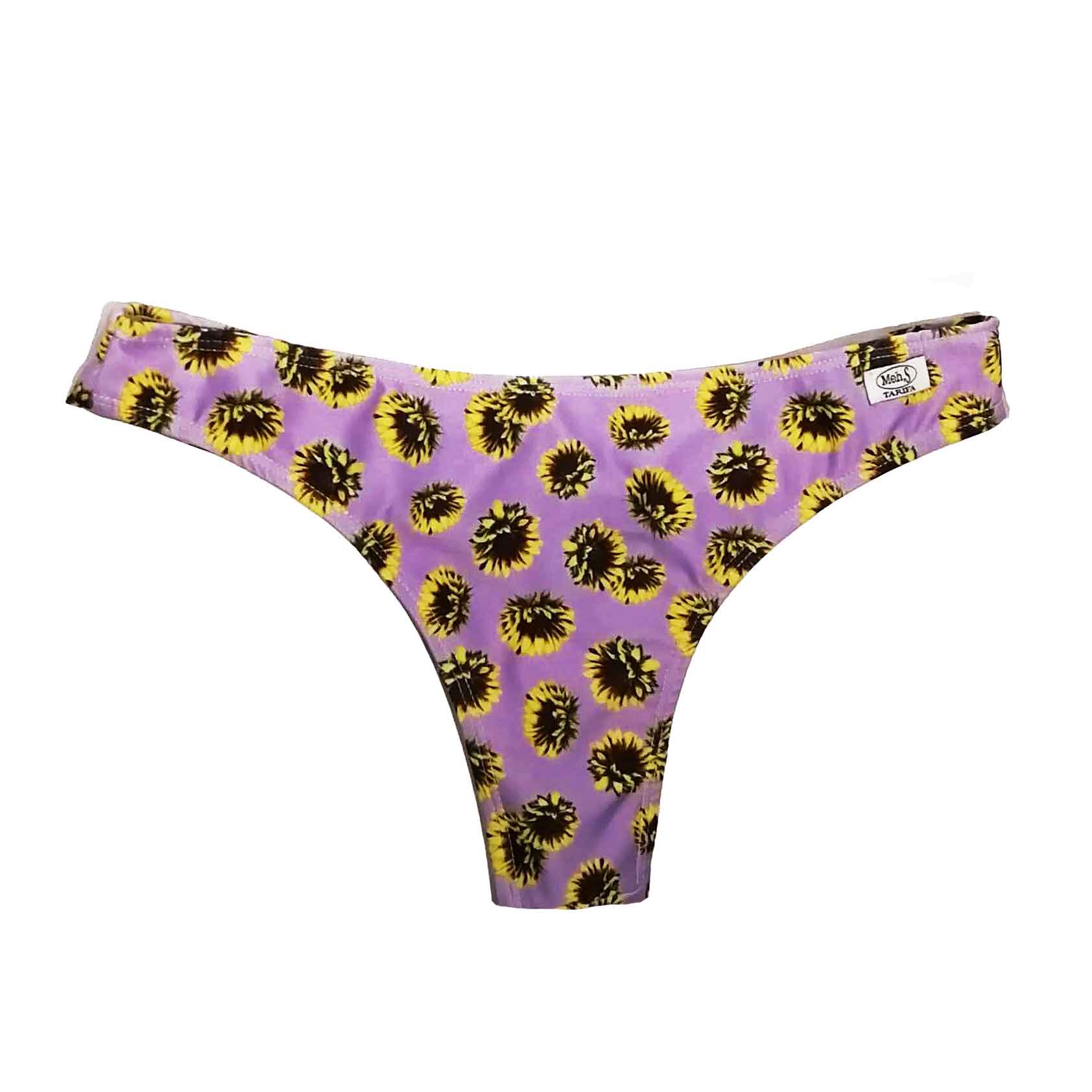 Braguita de bikini tipo tanga con estampado de girasoles sobre fondo lila, hecha a mano en Tarifa.