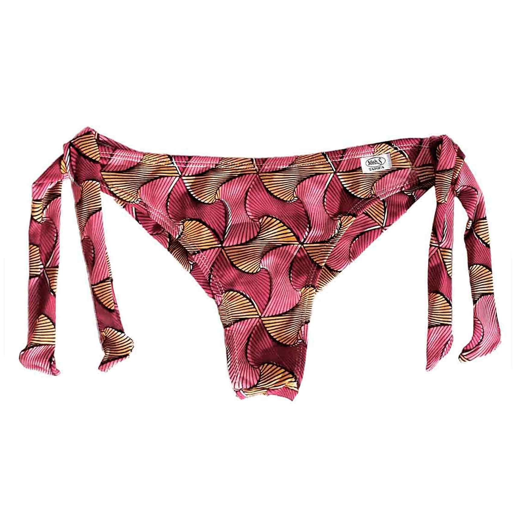 Braguita de bikini tipo semitanga con lazos laterales y estampado tribal rojo y amarillo, hecha a mano.