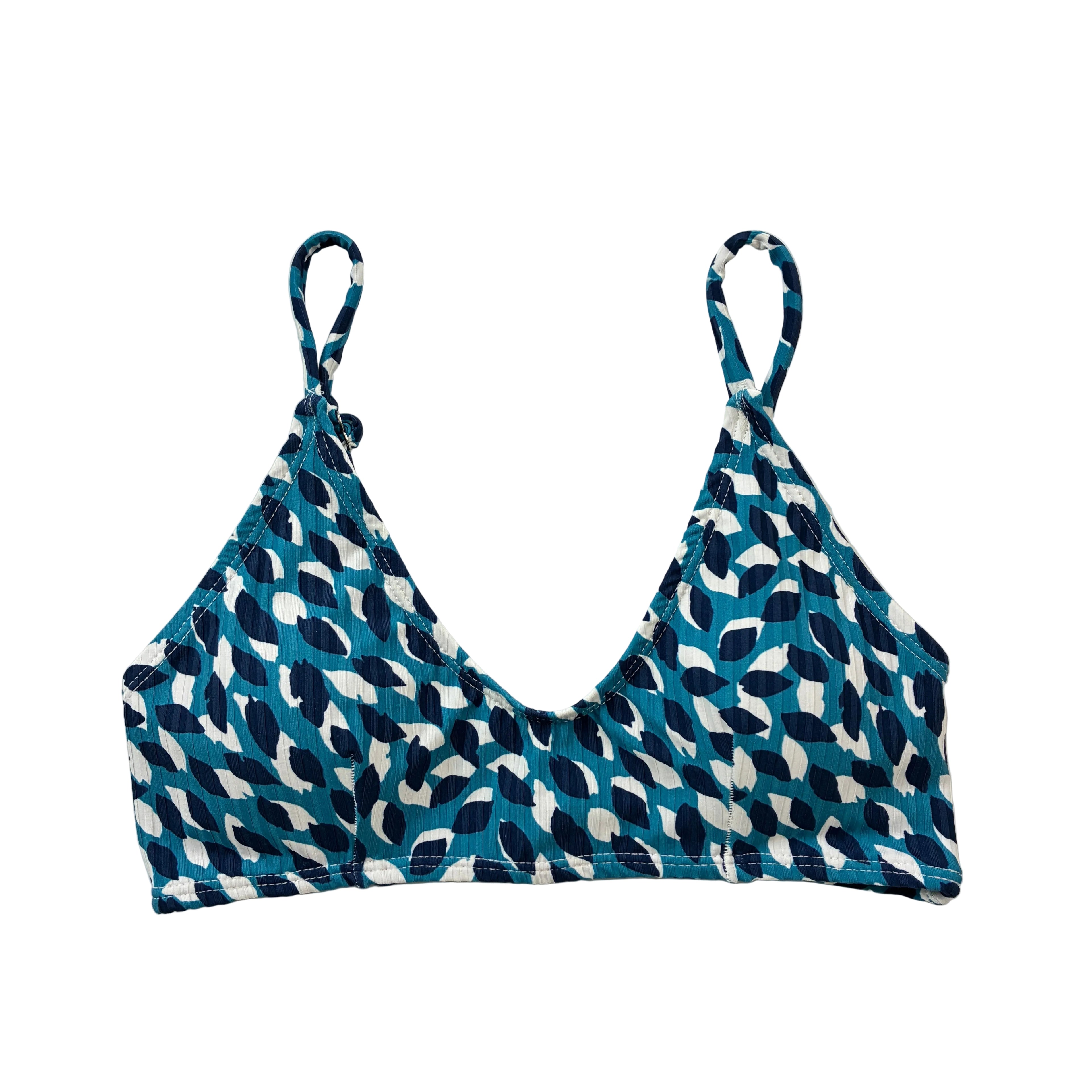 Top de bikini tipo bralette artesanal con textura de canalé y estampado gráfico en tonos azules, diseñado y confeccionado en Tarifa.