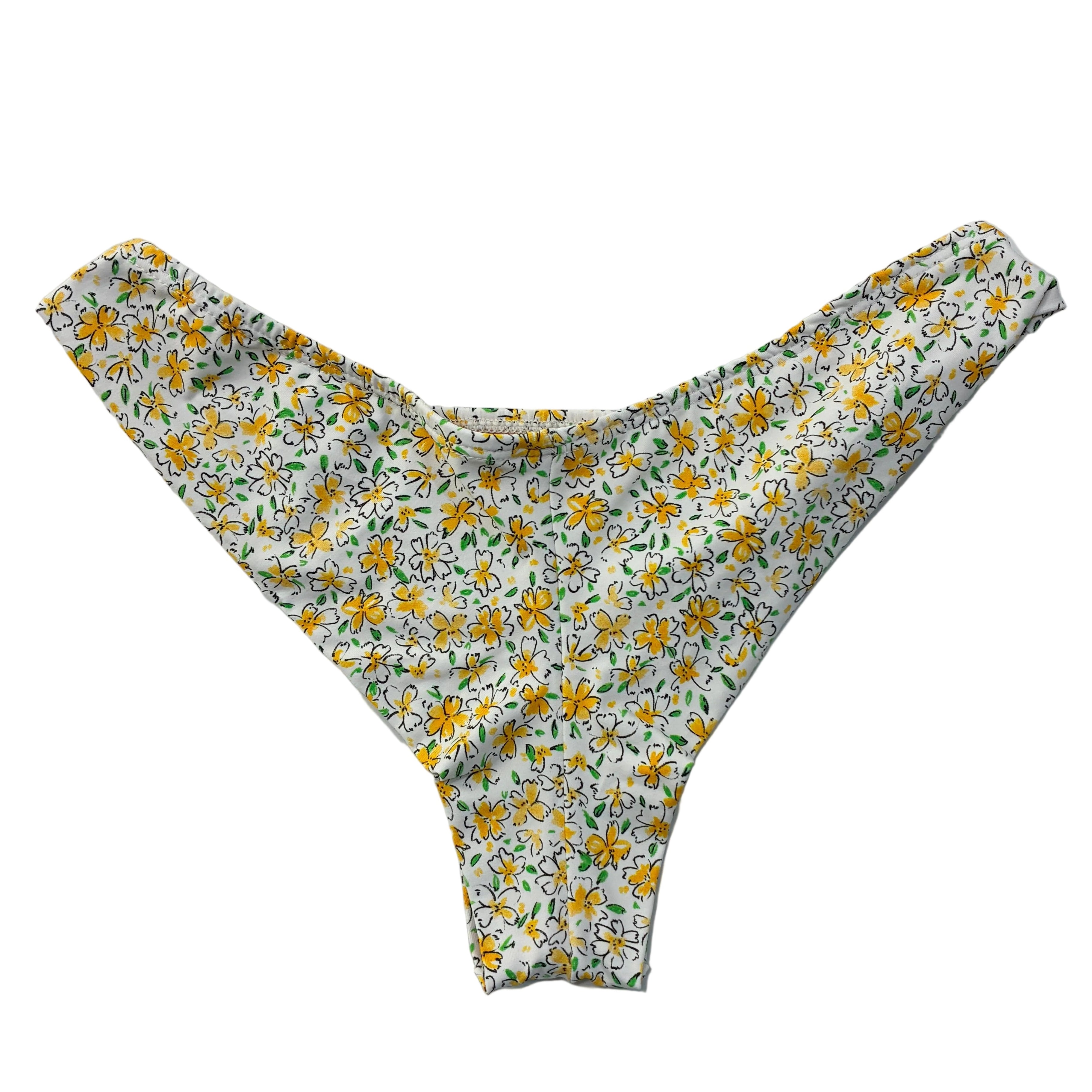 Parte de atrás de braga de bikini estampado flores amarillas con fondo blanco 